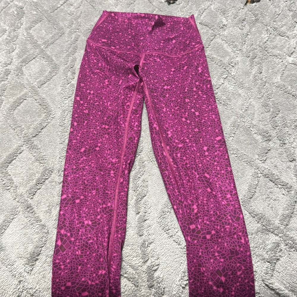 Women’s pink and purple, Lululemon size 4 leggings never been worn